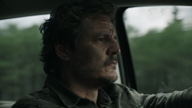 Joel stares intensely while driving through a wooded area, capturing a tense and emotional moment in The Last of Us finale.